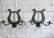 Load image into Gallery viewer, A pair of French metal lyre shaped candle wall sconces with glass flower decoration