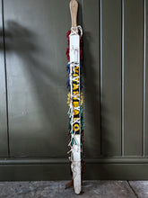 Load image into Gallery viewer, Vintage pig whip with rosettes 1960's red, blue, brown