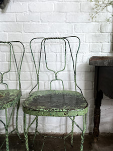 A pair of 1940's vintage French metal twisted wire green garden bistro chairs