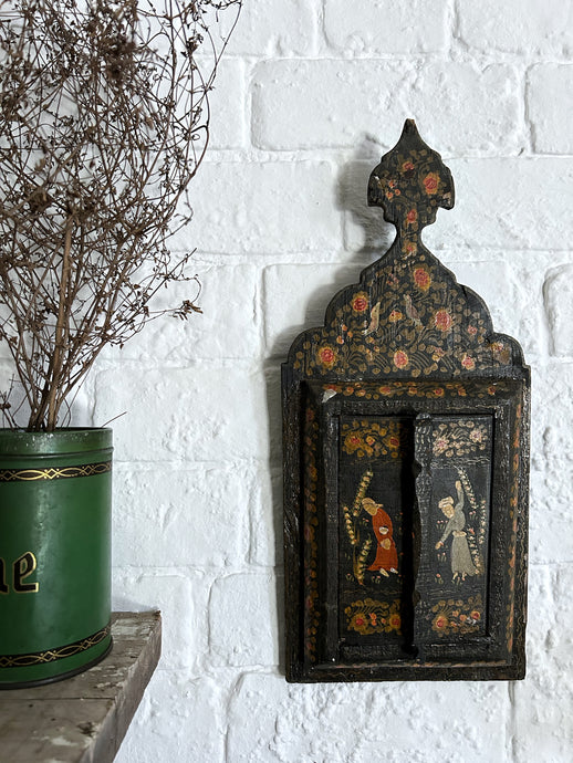 An antique early 20th Century Qajar Persian painted wooden mirror with two doors