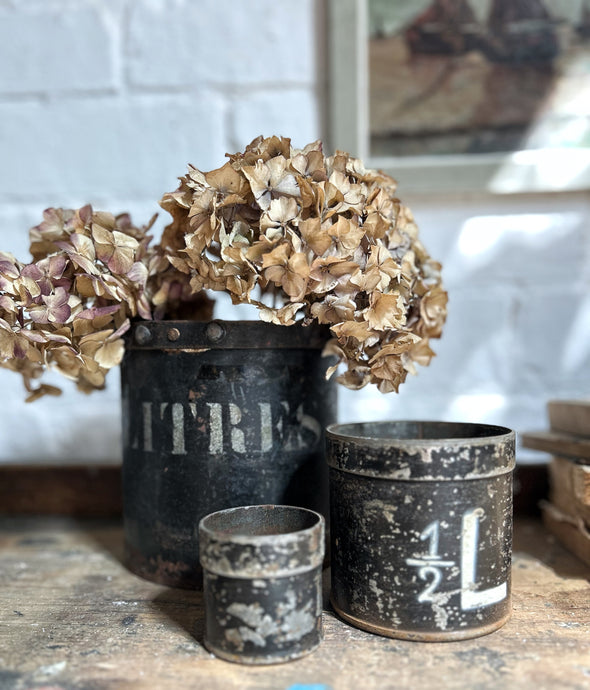 Antique Dutch black metal measuring cups