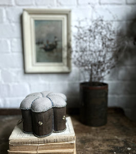 Antique early 20th Century French Linen weighted pin cushion with empire brass stars