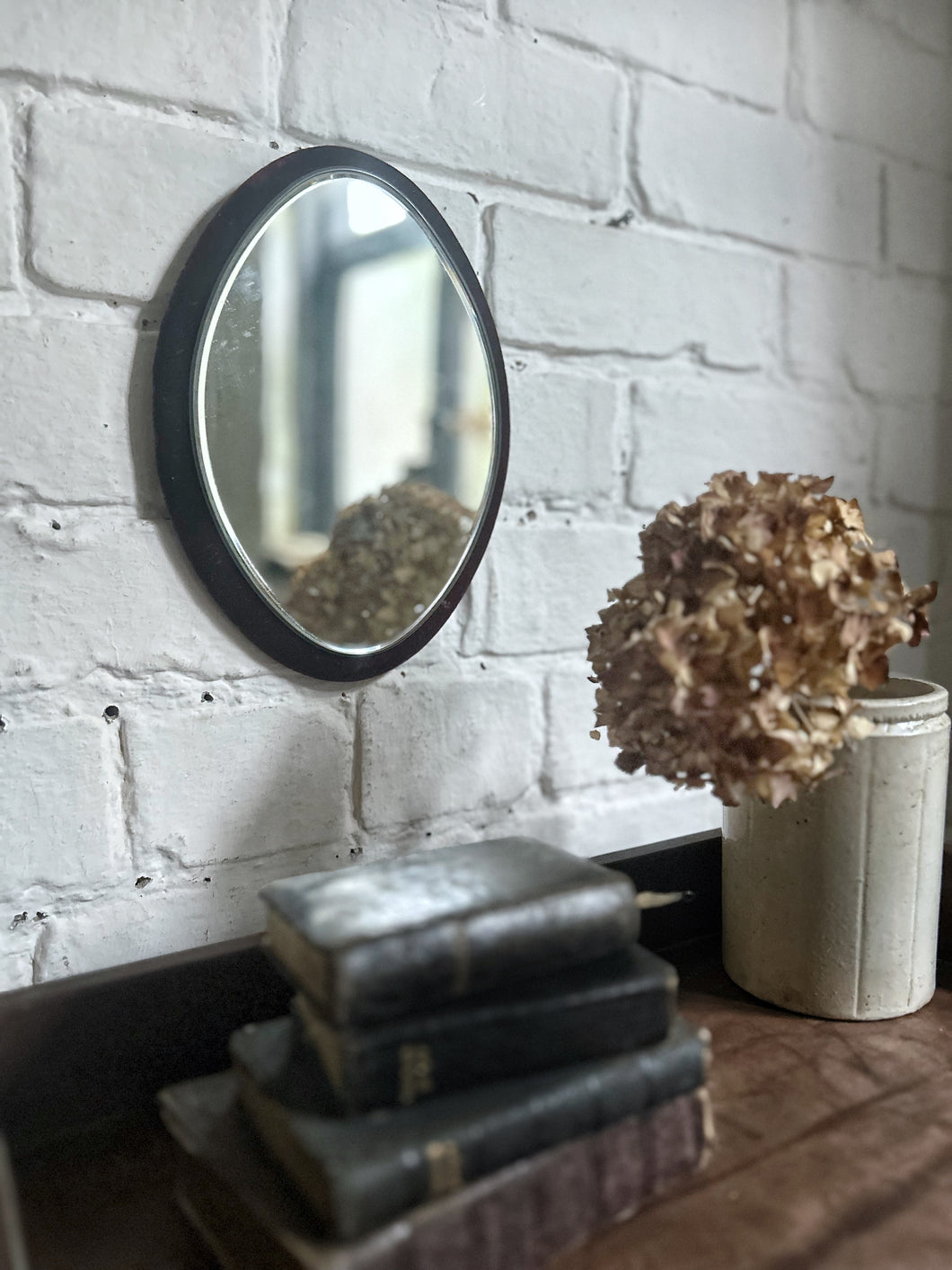 Antique red velvet framed oval wall mirror