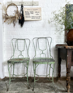 A pair of 1940's vintage French metal twisted wire green garden bistro chairs