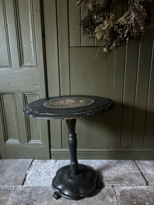 Black Victorian tilt top papier mache table with floral top and mother of pearl inlay