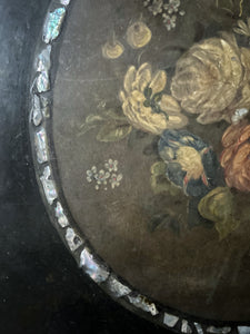 Black Victorian tilt top papier mache table with floral top and mother of pearl inlay