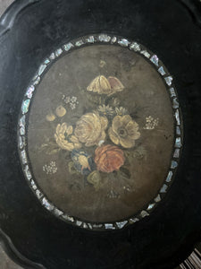 Black Victorian tilt top papier mache table with floral top and mother of pearl inlay