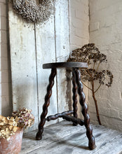 Load image into Gallery viewer, A French Vintage Demi Lune wooden tripod stool with twisted legs.