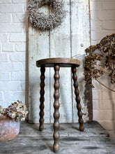 Load image into Gallery viewer, A French Vintage demi lune wooden tripod stool bobbin legs.