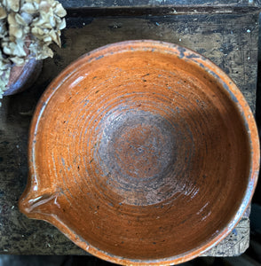 A large antique, French country kitchen, terracotta glazed, mixing, pouring bowl.