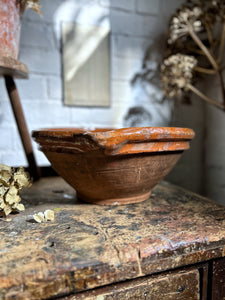 A large antique, French country kitchen, terracotta glazed, mixing, pouring bowl.
