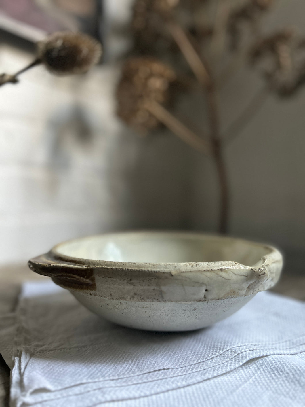A French antique white glazed shallow pouring bowl