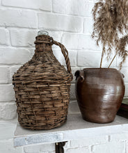 Load image into Gallery viewer, A 20th Century Vintage french wicker covered demijohn wine bottle