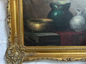 A vintage still life oil painting on board in gilt frame signed