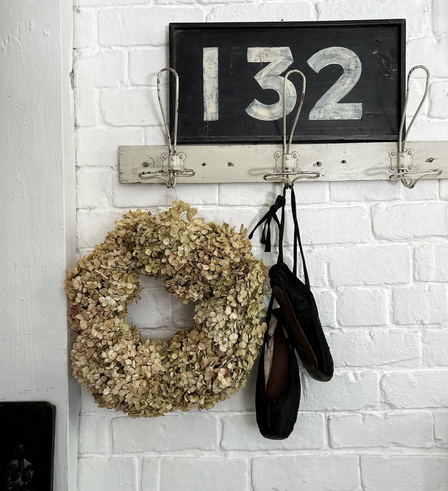 A hand made dried pale green hydrangea floral wreath