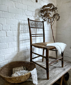 A Georgian antique faux bamboo painted  rush seat chair