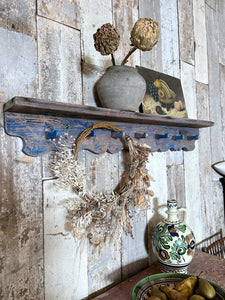 A Blue Painted Hungarian primitive wooden peg coat rack with shelf