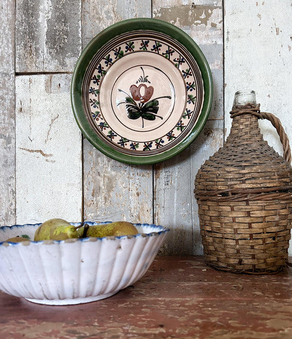 A decorative hand painted glazed Hungarian shallow dish