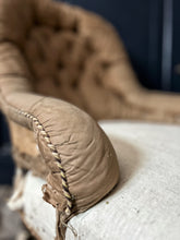 Load image into Gallery viewer, An antique distressed de-constructed button back slipper chair with turned legs &amp; castors