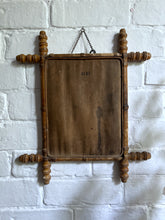 Load image into Gallery viewer, An antique Oxford cross faux bamboo wall mirror with distressed foxed glass plate