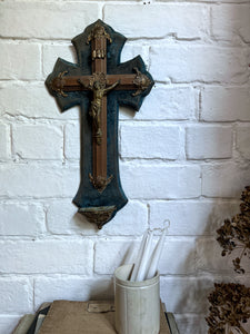 An antique blue velvet French church wall hanging Cross with religious figure