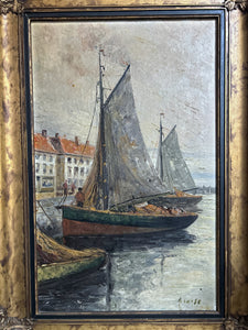 An antique seascape boat oil painting on canvas in original gilt frame, signed