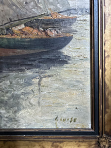 An antique seascape boat oil painting on canvas in original gilt frame, signed