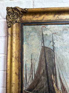 An antique Dutch sailor on jetty with boat oil painting in original gilt frame, signed.