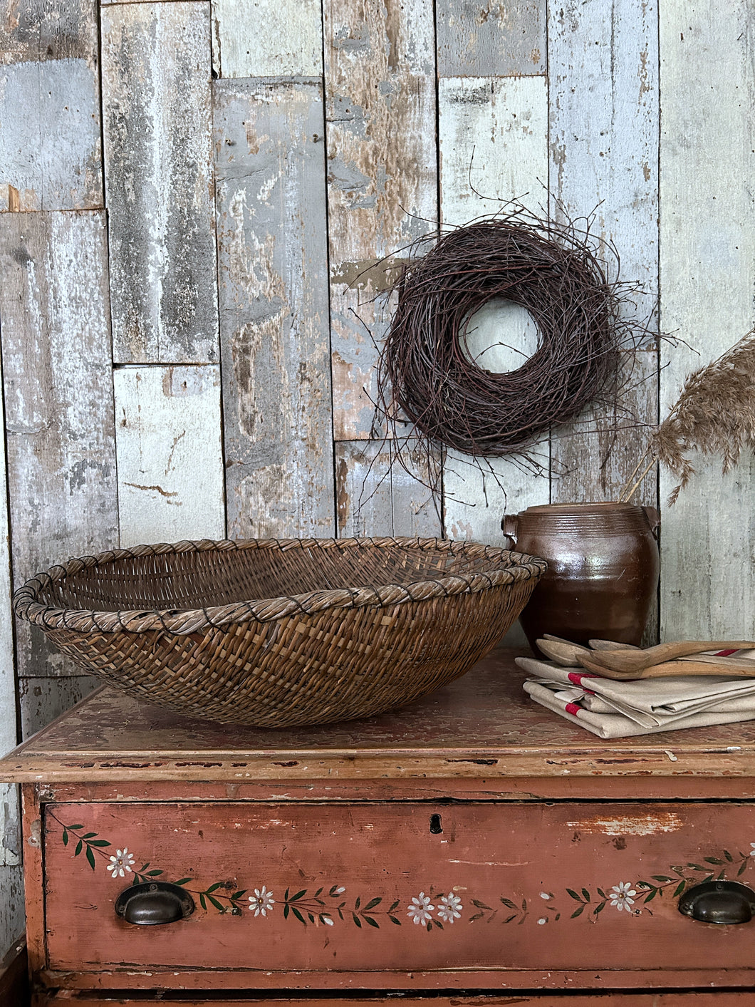 An antique rustic woven wicker Japanese tea basket