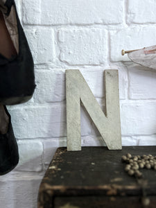 A vintage original painted wooden letter N