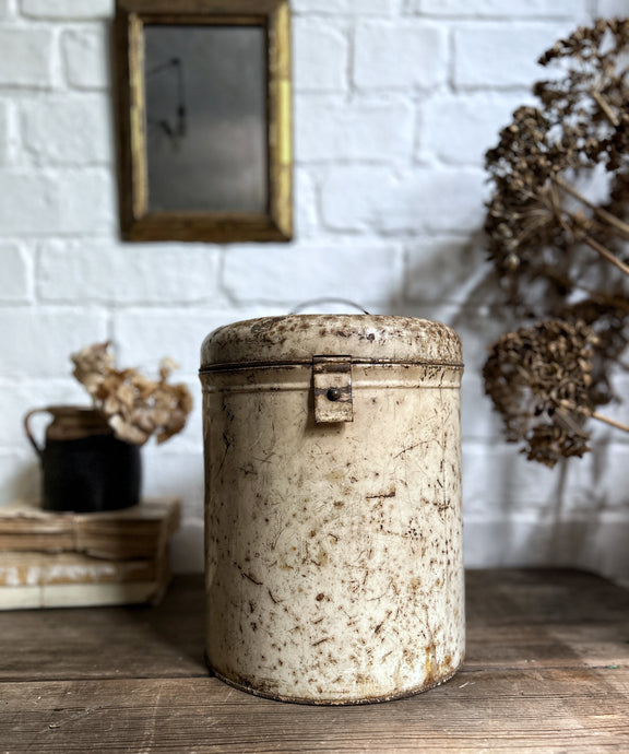 A cream coloured metal Toleware large kitchen storage tin
