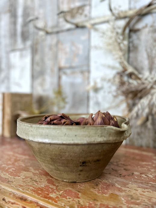 A vintage terracotta tian dairy bowl with glazed rim