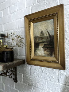 An antique oil painting on canvas of London with Thames barges on the river