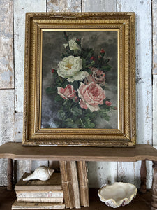 An antique early 20th Century still life floral oil painting on canvas in gilt frame