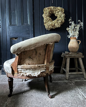 Load image into Gallery viewer, An antique Napoleon III French deconstructed button back tub chair with turned legs