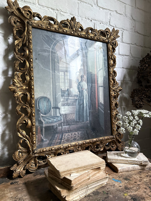 Large antique baroque style decorative gilded frame with vintage print
