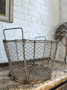 Large vintage wire storage basket with handles