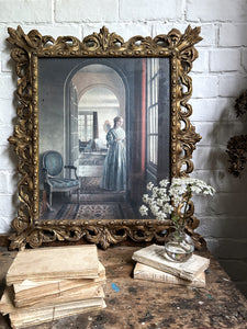 Large antique baroque style decorative gilded frame with vintage print