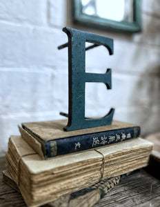 Metal industrial blue painted capital upper case letter E