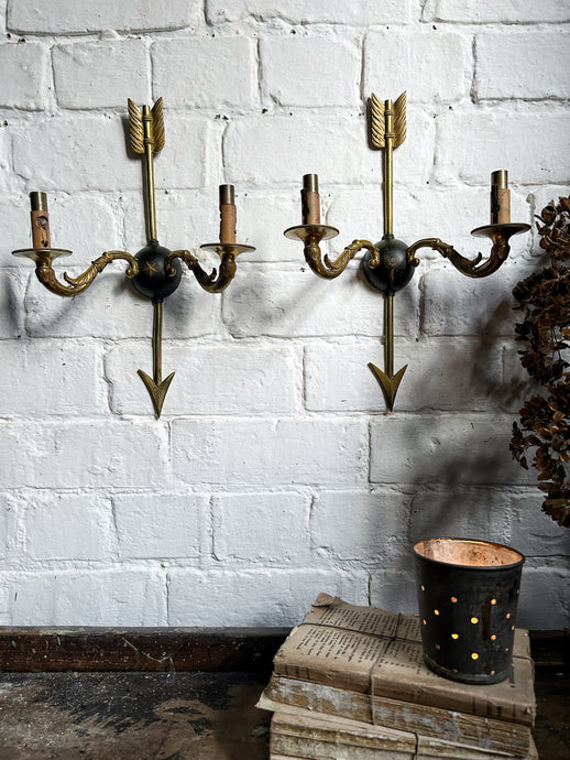 Pair of antique French Empire brass arrow & star wall lights