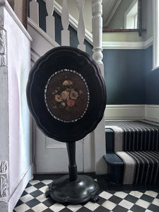 Black Victorian tilt top papier mache table with floral top and mother of pearl inlay