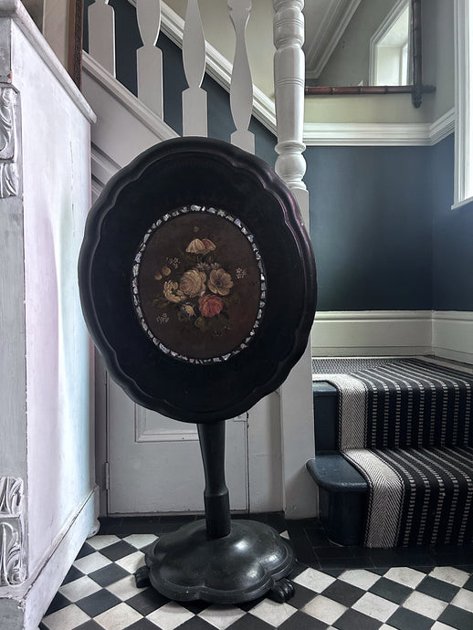 Black Victorian tilt top papier mache table with floral top and mother of pearl inlay