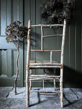 Load image into Gallery viewer, Primitive coppiced wood twig chair with carved mouse on back