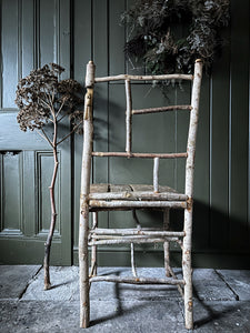 Primitive coppiced wood twig chair with carved mouse on back