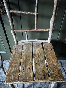 Primitive coppiced wood twig chair with carved mouse on back