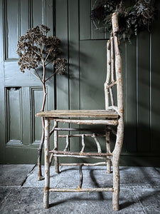 Primitive coppiced wood twig chair with carved mouse on back