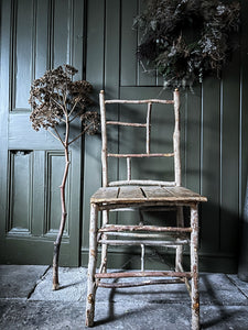 Primitive coppiced wood twig chair with carved mouse on back