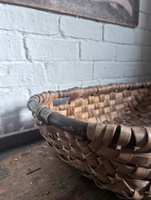 Load image into Gallery viewer, A Vintage coppiced wooden woven oak swill basket with darker bent wood rim.
