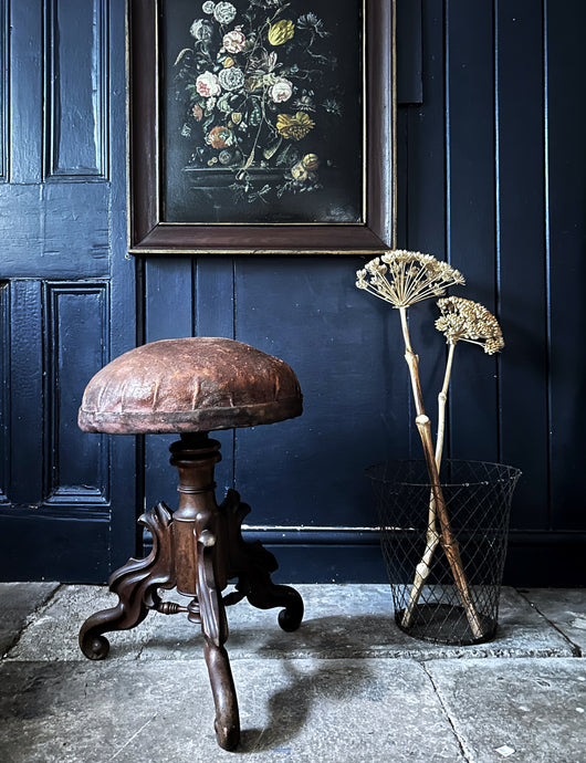 A Victorian Late 19th century Antique walnut carved, adjustable piano stool with distressed leather seat