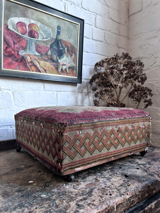 Vintage Anatolian Turkish Kilim footstool with brass castors and woven border